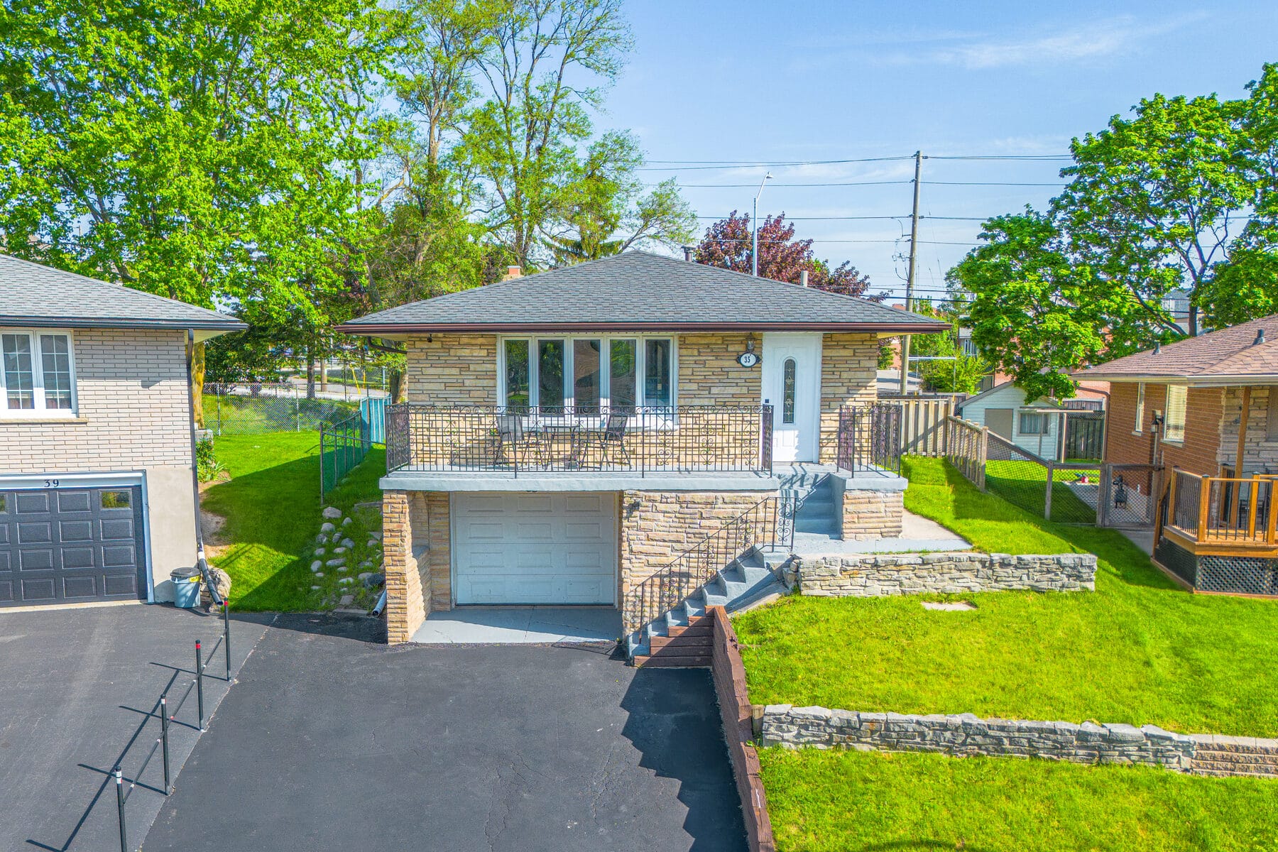 Stone bungalow exterior photographed for a Kitchener listing